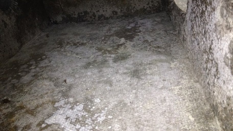 The inside of a silver air duct before cleaning